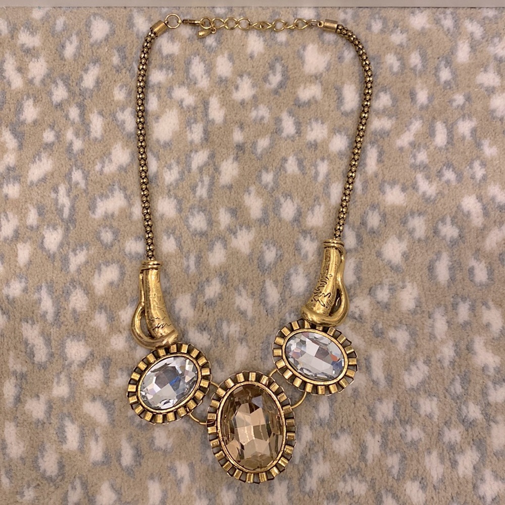 Brass/bronze color necklace, with 3 large gems/rhinestones.